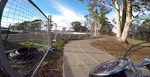 Weaving around the construction of an underpass for safer cycling and pedestrian.