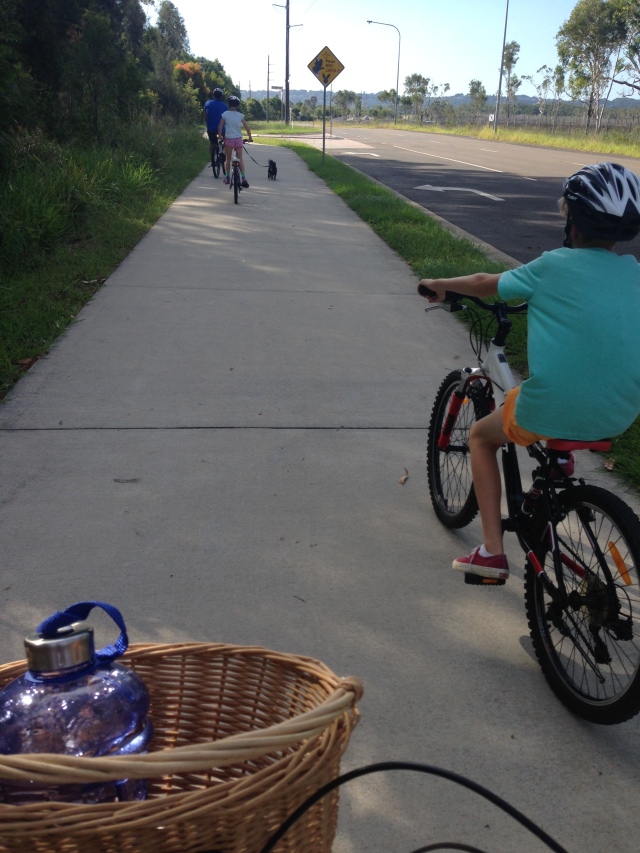 Family bike ride with Fluffy the dog running along too.
