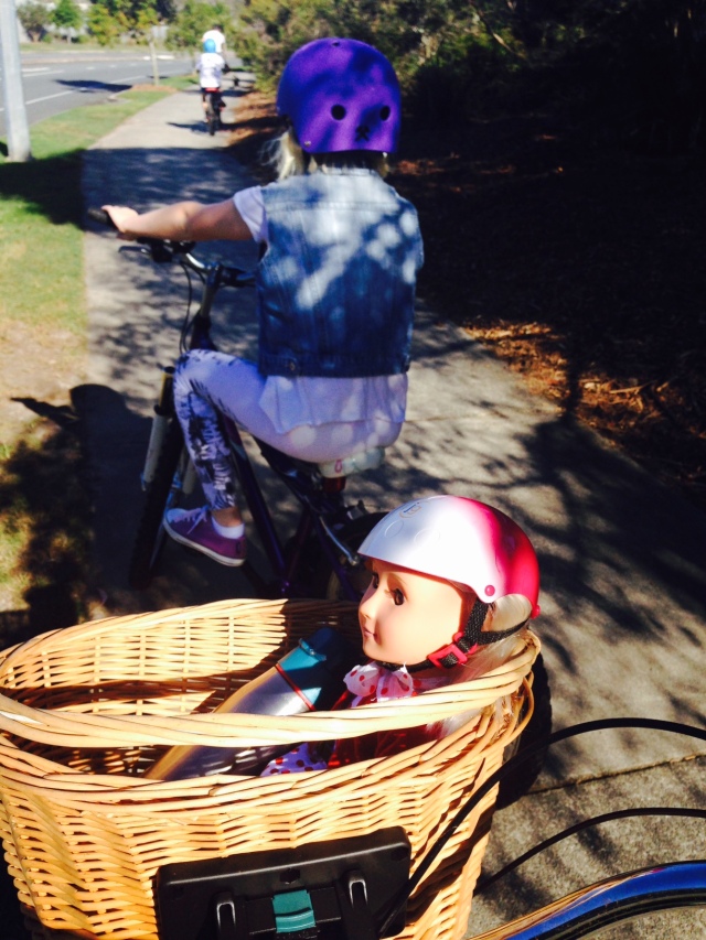 Safely in the basket, Rose rides too, complete with helmet! Photo: TL Coker
