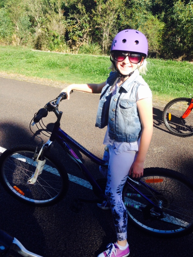 Style rider with cool coordinates - purple bike, purple shoes, purple helmet.